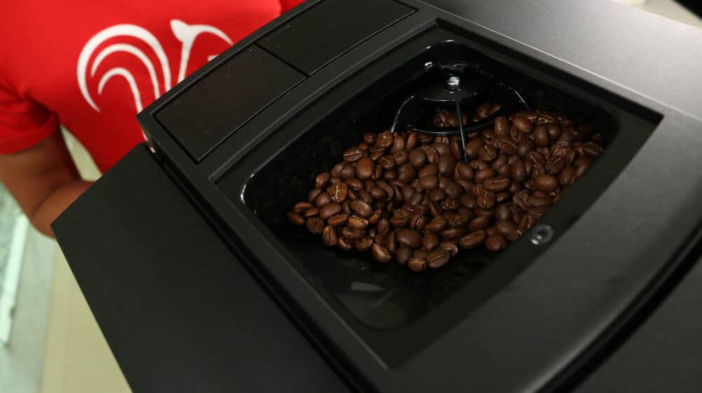 A closer look inside the bean hopper on the Jura E8 super-automatic espresso machine.