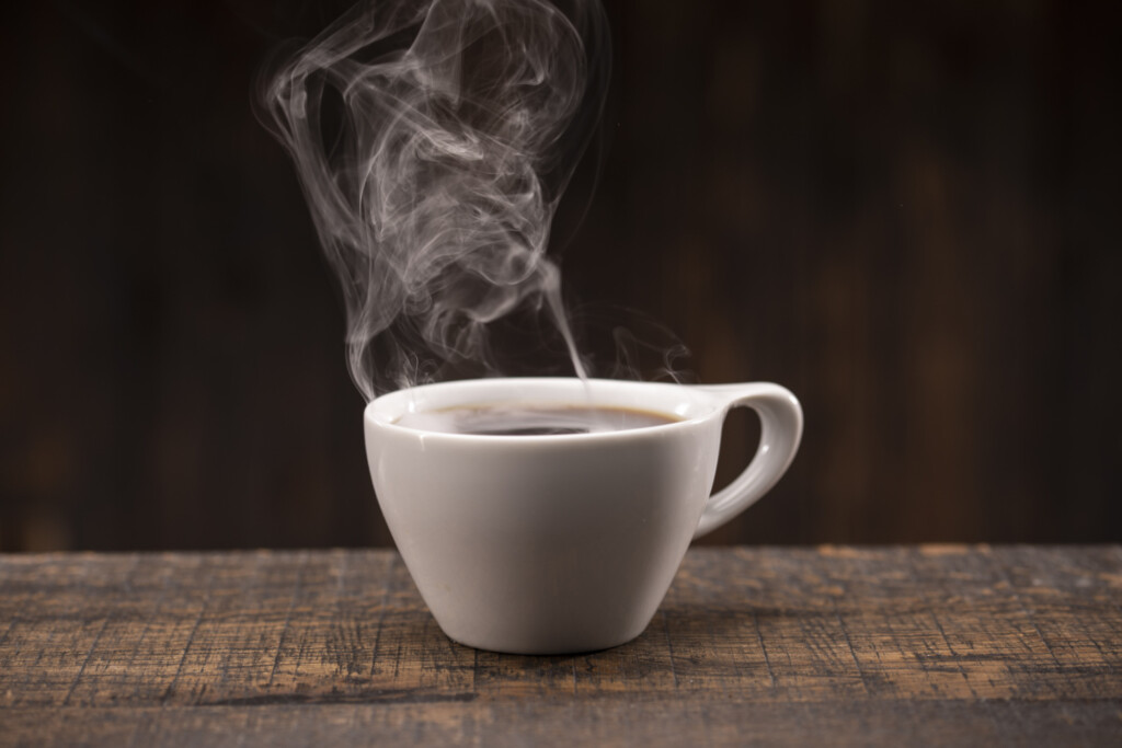 Fresh, hot steaming Coffee in a White Cup