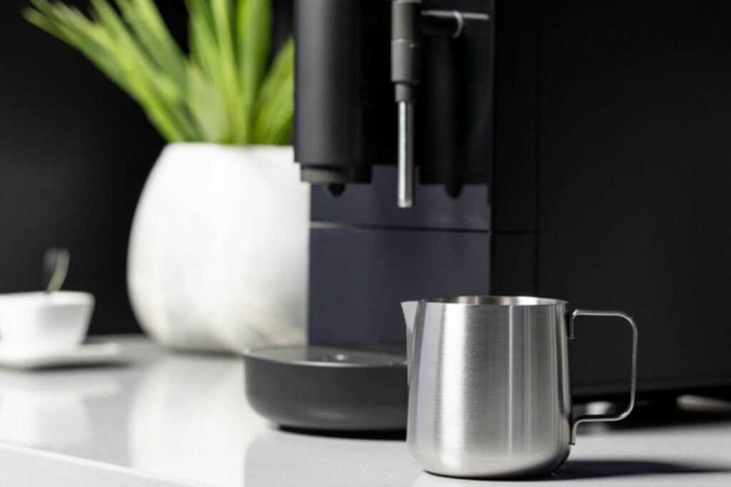 Closeup of the milk frothing pitcher included with the GE Profile Automatic Espresso Machine.