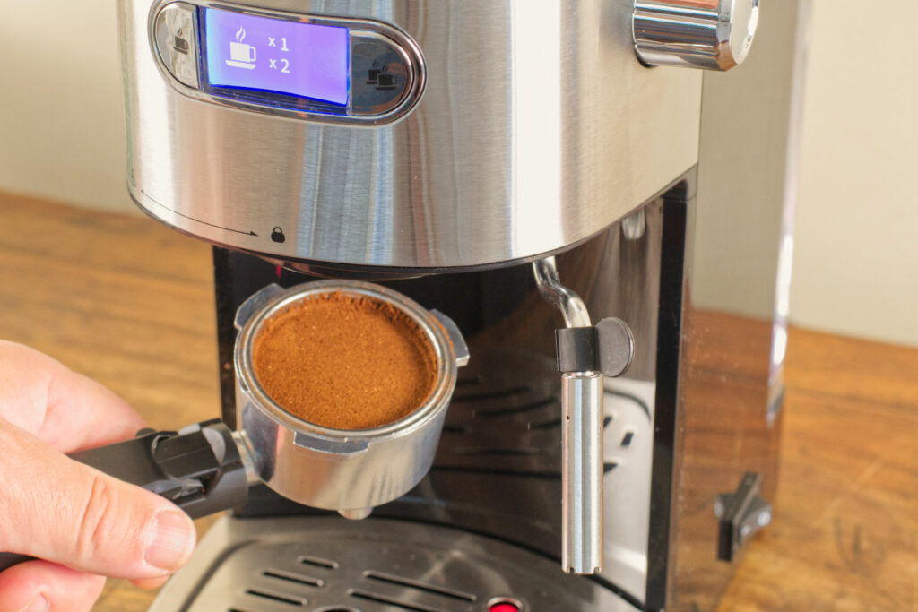 Inserting the portafilter in to the Gevi 20 Bar Espresso Machine.