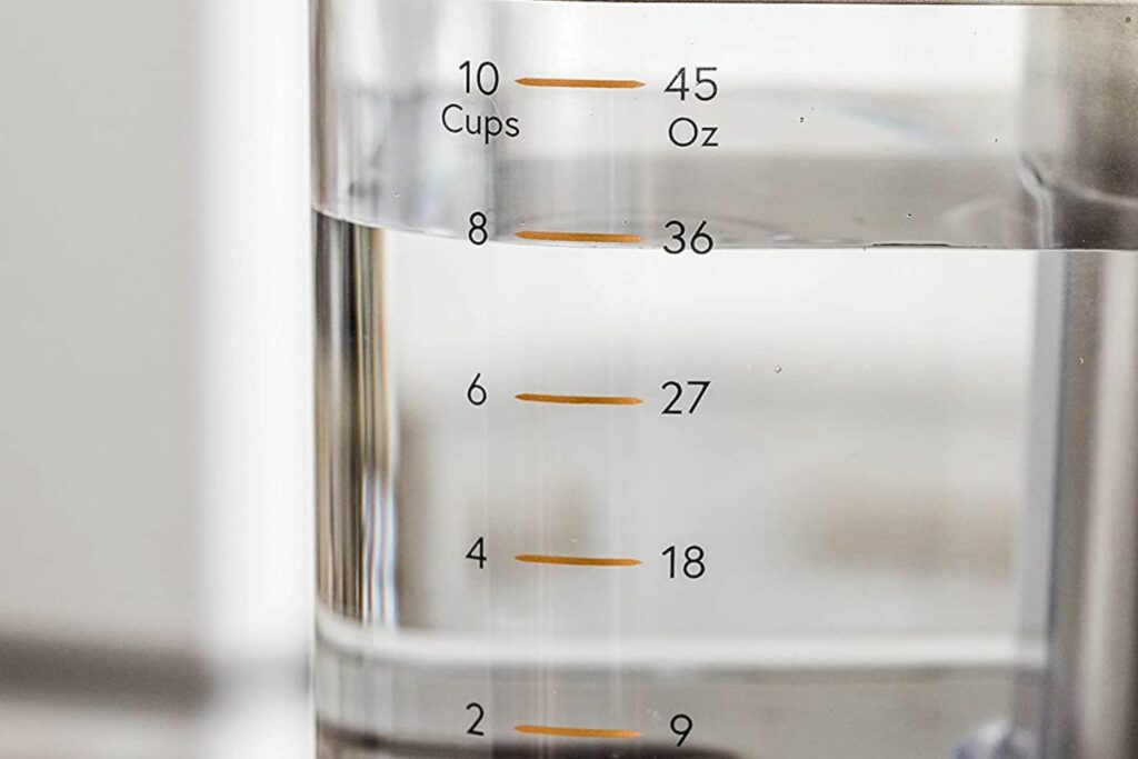Closeup of the Café coffee maker water reservoir showing the level markers