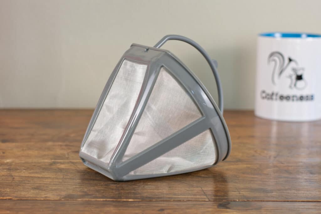 The SMEG coffee maker's reusable mesh filter.